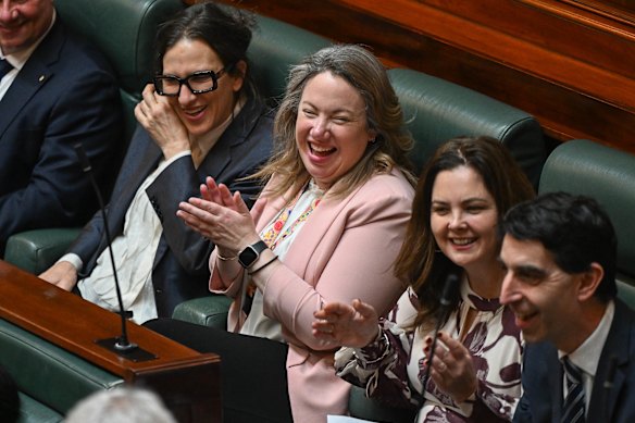 Labor MP Emma Vulin, between Health Minister Mary-Anne Thomas (left) and Belinda Wilson, spoke about living with MND during debate about voluntary assisted dying amendments.