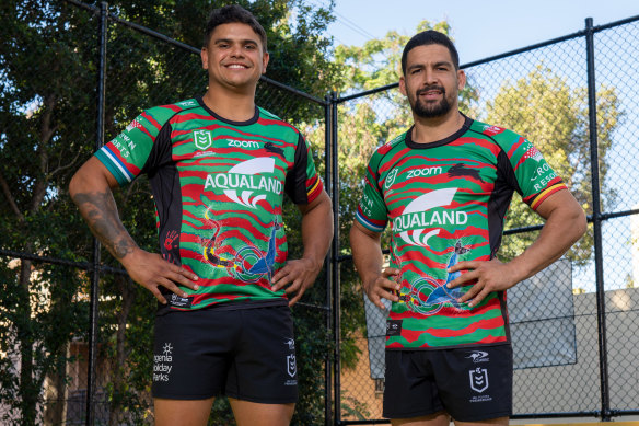 Latrell Mitchell and Cody Walker model the 2021 South Sydney Indigenous jersey.
