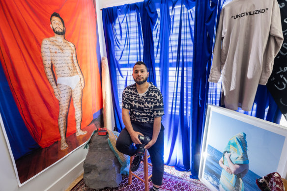 Photographic artist Ayman Kaake pictured in his Melbourne studio. The View-Master gifted to him by his mother can be seen next to him.