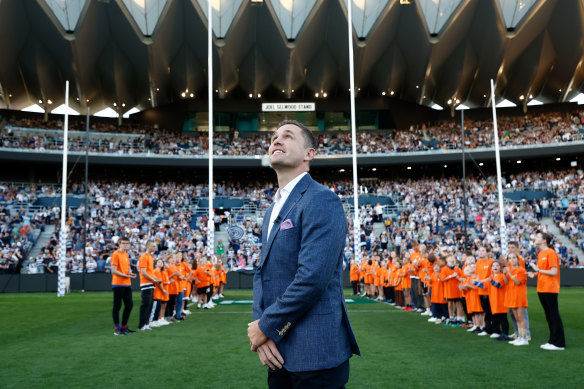 Joel Selwood stands in front of the new Joel Selwood Stand at GMHBA Stafium, Geelong.
