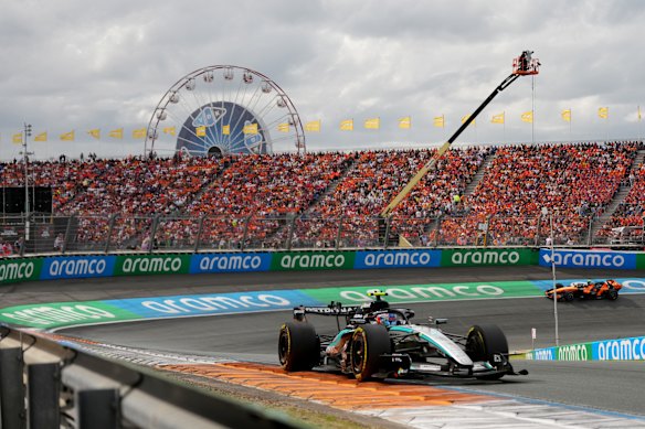 Kimi Antonelli with a McLaren in hot pursuit.