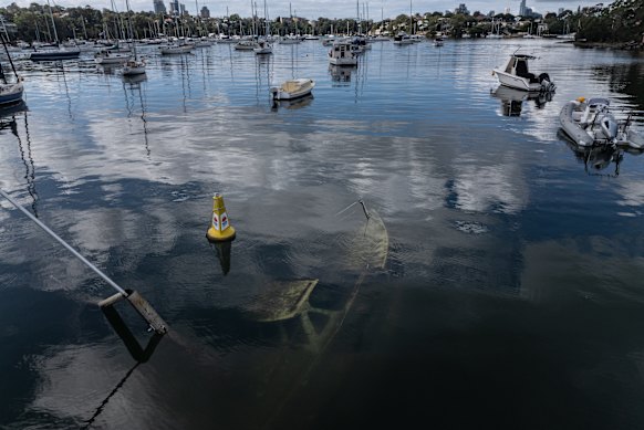 A submerged yacht in Woodford Bay, a hidden inlet on the Lane Cove River that has become a dumping ground for old boats.
