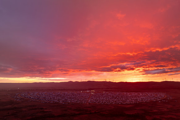 Beauty and the bash … red skies over the camp site on the edge of the desert.