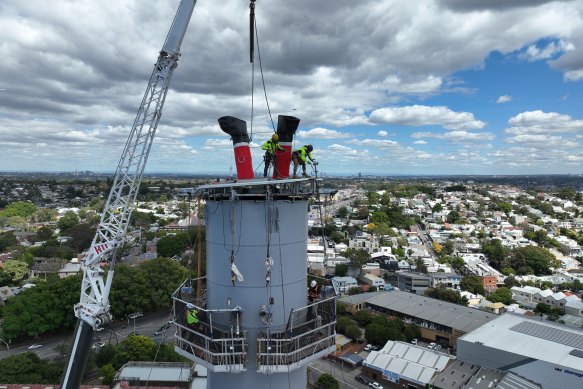 Santa’s boots being installed in one of the restored White Bay Power Station chimneys this year.