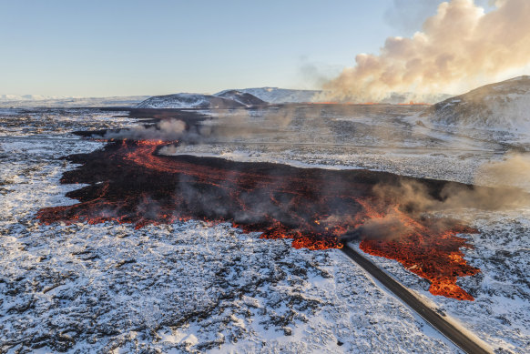 A view of lava crossing the main road to Grindavík and flowing on the road leading to the Blue Lagoon during an eruption last month.