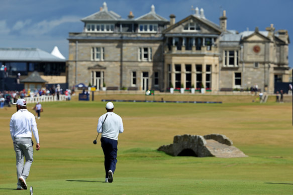 Tiger Woods walks from the 18th tee towards the Swilcan Bridge at St Andrews.