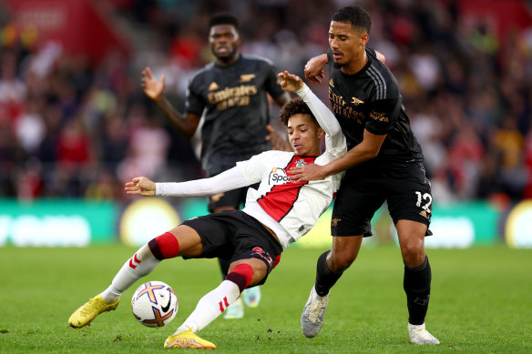 Southampton’s Mohammed Salisu is challenged by Arsenal’s William Saliba.