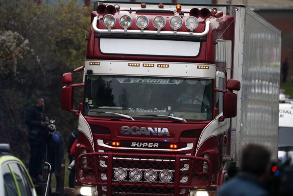 Police escort the truck in which the bodies were found on Wednesday.