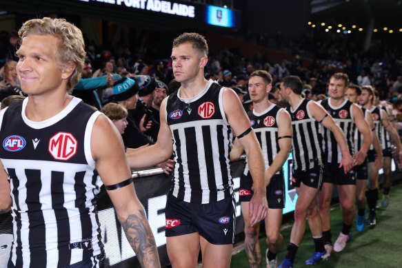 Port Adelaide’s Dan Houston (second from left) wore the black and white in South Australia