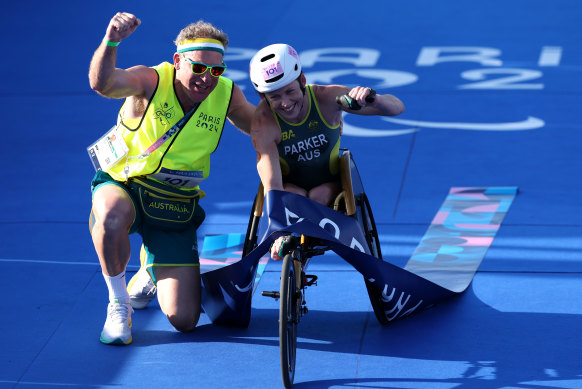 Triathlete Lauren Parker celebrates winning gold.