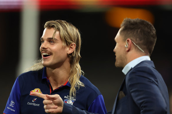 Bailey Smith moving to the Cats to help build the next-generation Geelong midfield after the retirement of Joel Sewlwood (right), now a commentator  