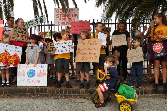 Sydney primary school students and parents demand urgent action on climate change during a protest last year. 