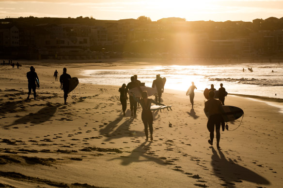 Surfers return to Bondi Beach on Tuesday with more restrictions to be lifted in NSW.