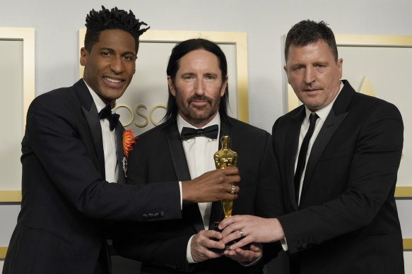 Jon Batiste, Trent Reznor and Atticus Ross with their Oscar for original score for Soul.