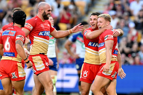 Max Plath of the Dolphins celebrates with teammates after scoring a try during the round 27 match.