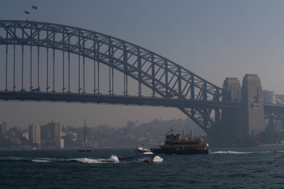 Haze over Sydney Harbour on Tuesday from hazard reduction burns. 