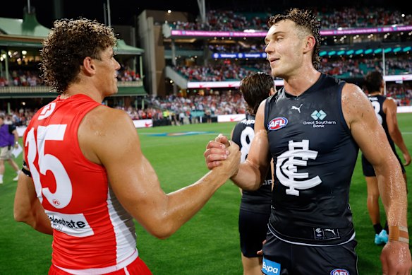 Charlie Curnow with former skipper Patrick Cripps after the SCG clash.