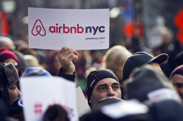 Supporters of Airbnb hold a rally outside City Hall in New York.