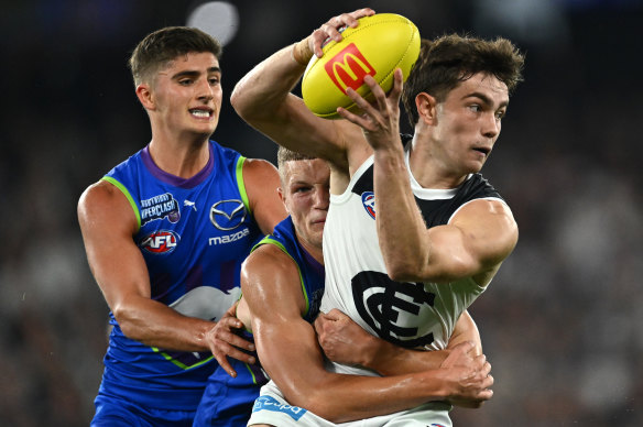 Jack Carroll of the Blues is tackled by Zane Duursma of the Kangaroos.