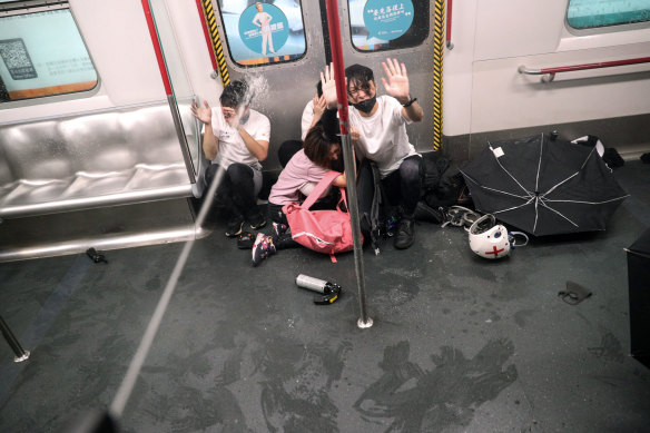 Police shoot pepper spray at protesters inside a train at Prince Edward Station, in Hong Kong, August 31, 2019.