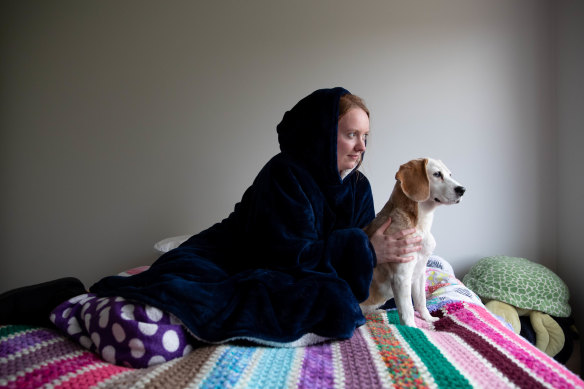 Rachael Hayward keeps warm by wearing an Oodie, saving on heating costs in Sydney.