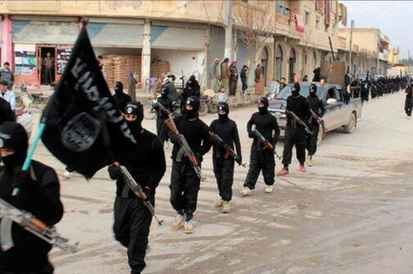 Fighters from the Islamic State group marching at the height of their power in  Raqqa, Syria.