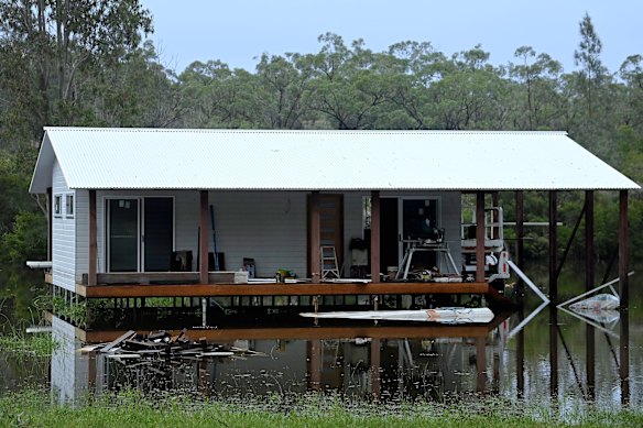 A home on Manning Point Road near Bohnock is surrounded by floodwaters.