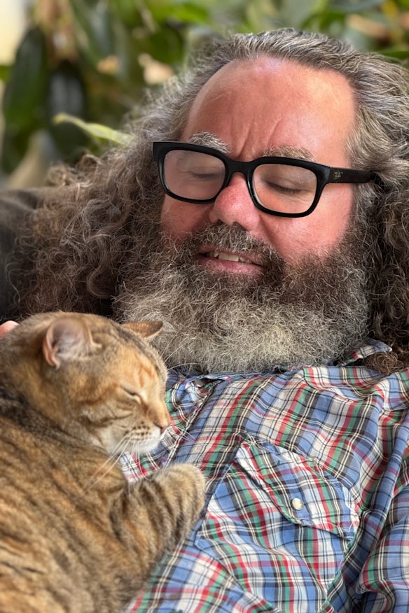 Brendan Foster and Sabrina the cat. 