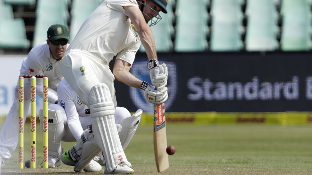 Australian batsman Shaun Marsh plays a shot as South Africa's wicketkeeper Quinton de Kock.