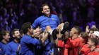 Team Europe’s Roger Federer is lifted by fellow players after playing the final game of his illustrious career.