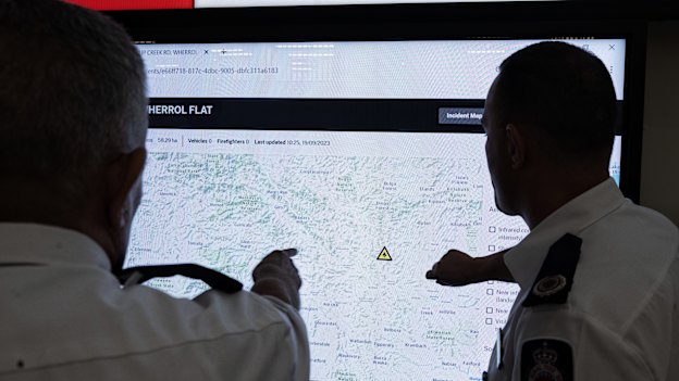 NSW RFS Commissioner Rob Rogers and Assistant Commissioner Ben Millington demonstrate the Athena system at their headquarters in Sydney.