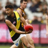 ELBOURNE, AUSTRALIA - MAY 14: Marlion Pickett of the Tigers
 runs with the ball during the round nine AFL match between the Hawthorn Hawks and the Richmond Tigers at Melbourne Cricket Ground on May 14, 2022 in Melbourne, Australia. (Photo by Darrian Traynor/AFL Photos/via Getty