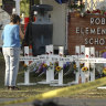Dora Mendoza, grandmother of shooting victim Amerie Jo Garza, wipes tears from her eyes at a memorial site at Robb Elementary School.
