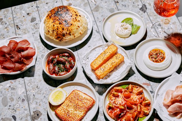 A spread including house-made pita, burrata, white bean hummus, mortadella and basturma.