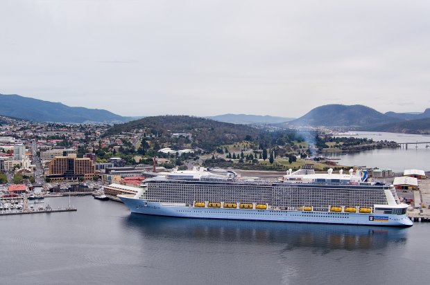 The cruise ship Ovation of the Seas arrives in Hobart in 2016; such tourist-filled vessels are a boon for Tasmania’s economy.