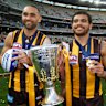 Shaun Burgoyne and Cyril Rioli celebrate the 2014 premiership win by Hawthorn.