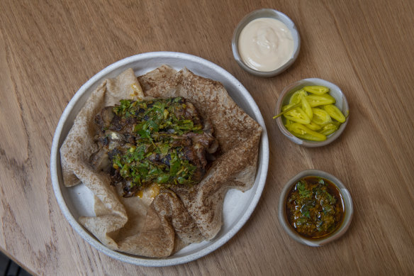 Aalia’s lamb neck shawarma with accompaniments.