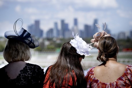 Racegoers on the Lexus marque balcony.