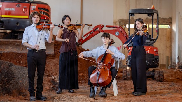 The Australian National Academy of Music is staking its future – and tens of millions of dollars – on an old town hall in inner Melbourne. Pictured from left to right: students Jonah Spriggs, Hannah Tyrrell, James Monro and Mattea Osenk.