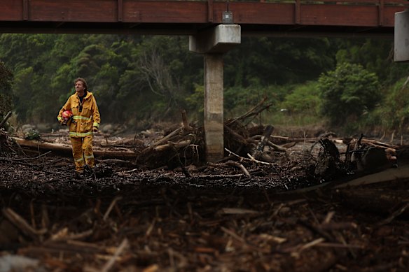 Wye River CFA captain Andy Hack helps with the clean-up along the Great Ocean Road after last week’s floods.