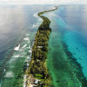 A strip of land between the Pacific Ocean, left, and lagoon in Funafuti, Tuvalu. The low-lying South Pacific island nation of about 11,000 people has been classified as ‘extremely vulnerable’ to climate change by the UN Development Program.