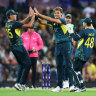 Spencer Johnson of Australia celebrates with team mates after claiming the wicket of Sahibzada Farhan