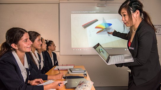 Maths teacher Ariel Fu and her students at Meriden School