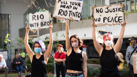 Hundreds rally outside of Rio Tinto's Perth headquarters following the destruction of a significant Aboriginal heritage site. 