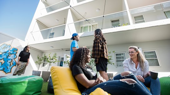 UKO Stanmore resident Fadzai Manungo talking to host Jamie Page in the common areas.