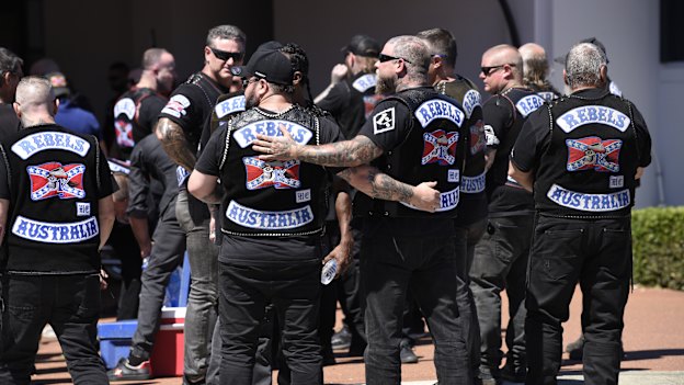 Rebels MC members embrace outside of the North Perth funeral where the body of slain boss Nick Martin is being kept. 