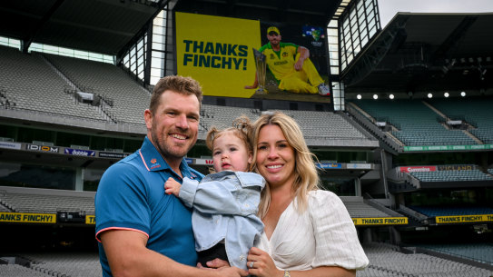 Aaron Finch with wife Amy and daughter Esther.