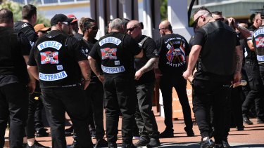 Rebels bikies arrive at the funeral home.