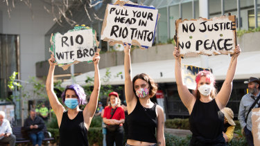 Hundreds rally outside Rio Tinto's Perth headquarters following the destruction of a significant Aboriginal heritage site. 