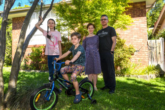 Melbourne couple Sarah Brennand and Rob Citroni, with their children Katia, 11, and Reuben, 8, are torn about the return to school.